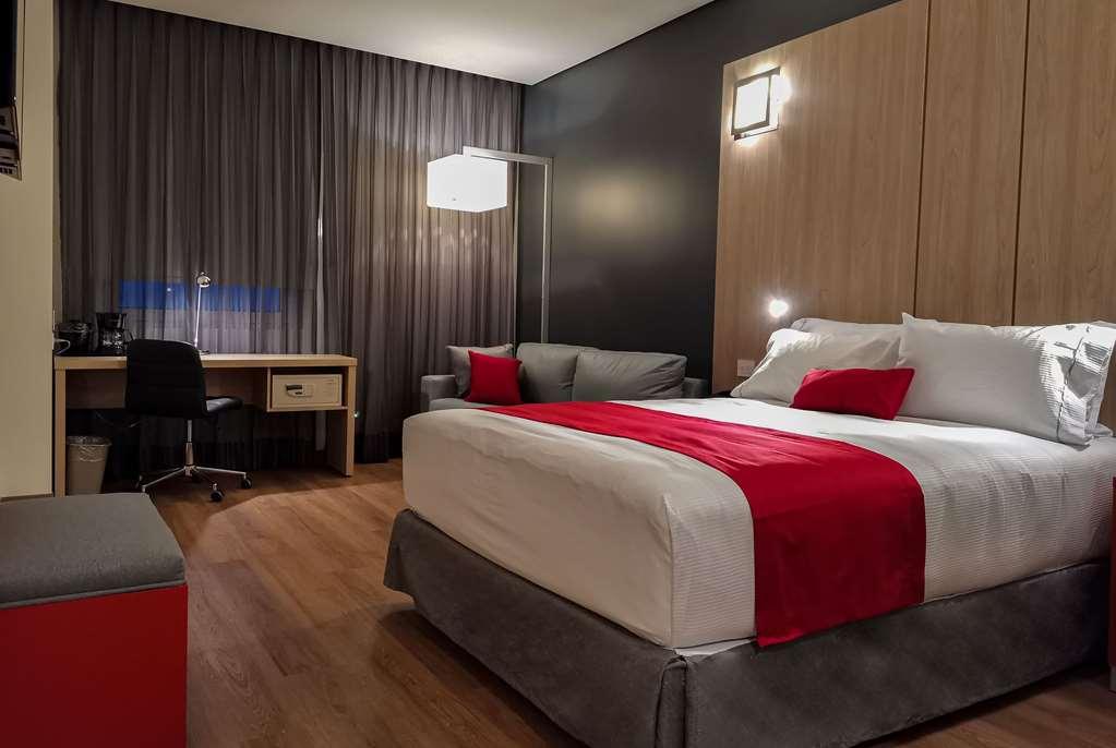 Ramada Encore By Wyndham Guadalajara Aeropuerto Las Pintas Zimmer foto